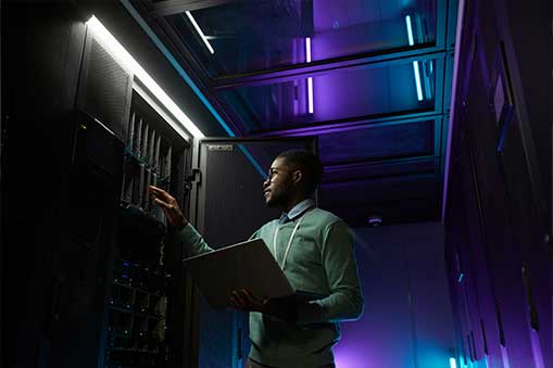 Person working on a server rack